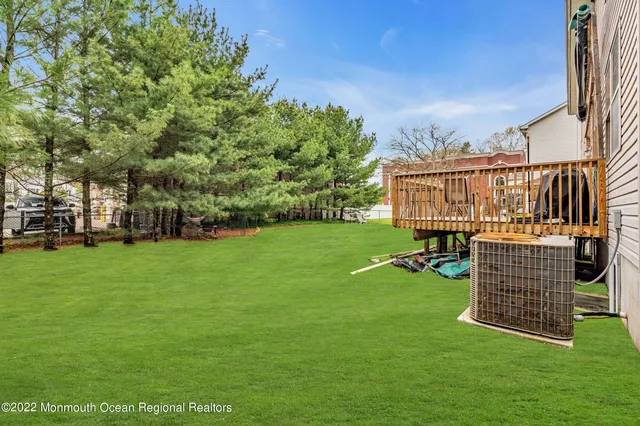 a view of a chairs and table in the garden