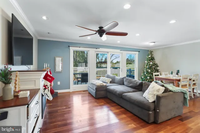 a view of a kitchen with cabinets and wooden floor