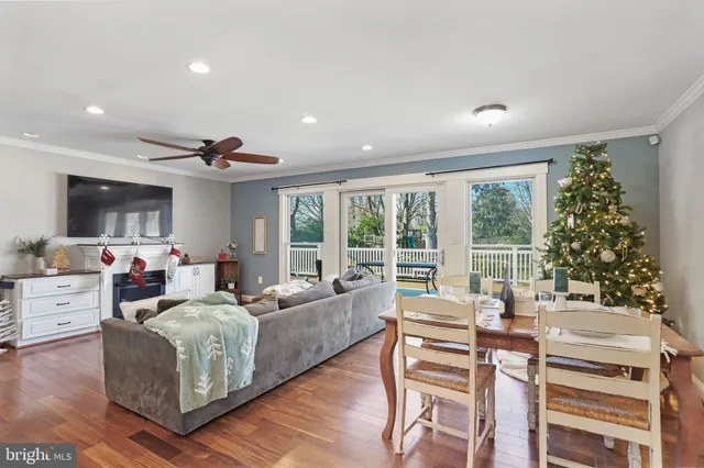 a bedroom with a large bed and a flat tv screen on dresser
