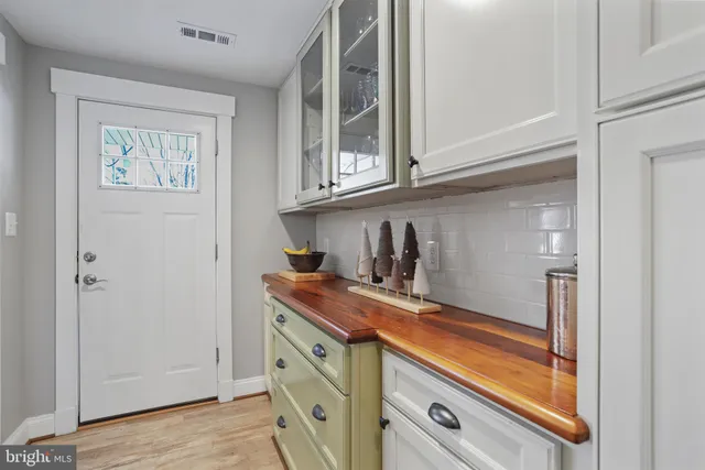 a bathroom with a double vanity sink mirror and shower