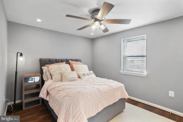 a living room with furniture and flowers