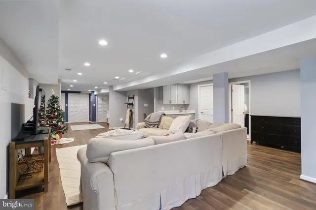 a living room with furniture and a rug