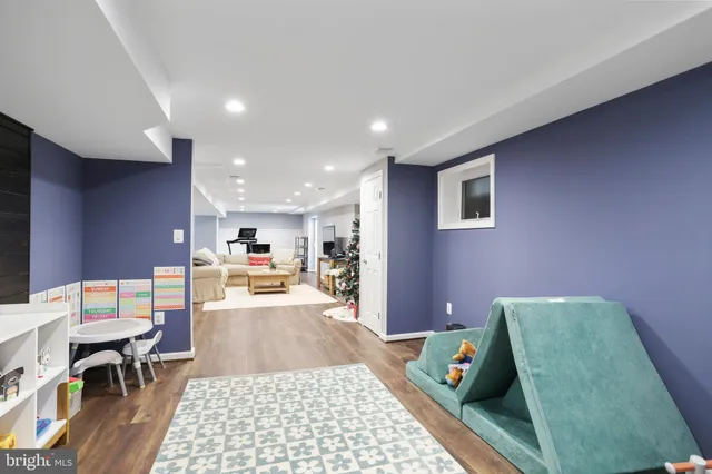 a view of a deck with furniture and trees