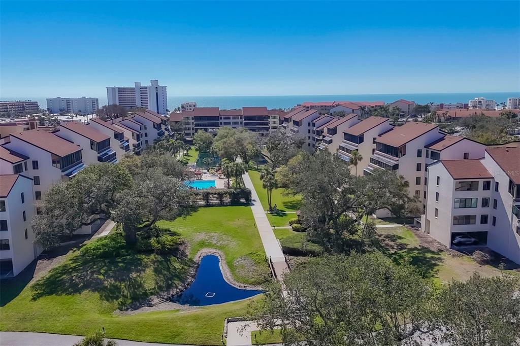 6285 Midnight Pass Road, Unit 403 Sarasota, FL 34242 - Photo 46 of 51 an aerial view of a house with a yard basket ball court and outdoor seating
