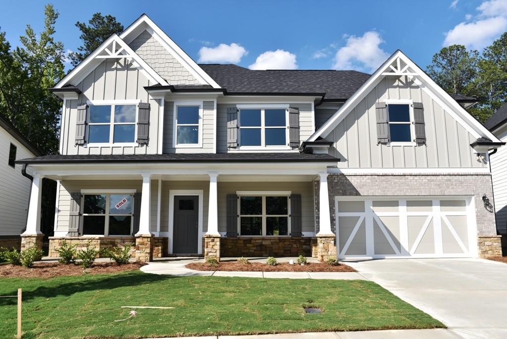 354 Wilkerson Way Grayson, GA 30017 - Photo 1 of 1 a front view of a house with garden and porch