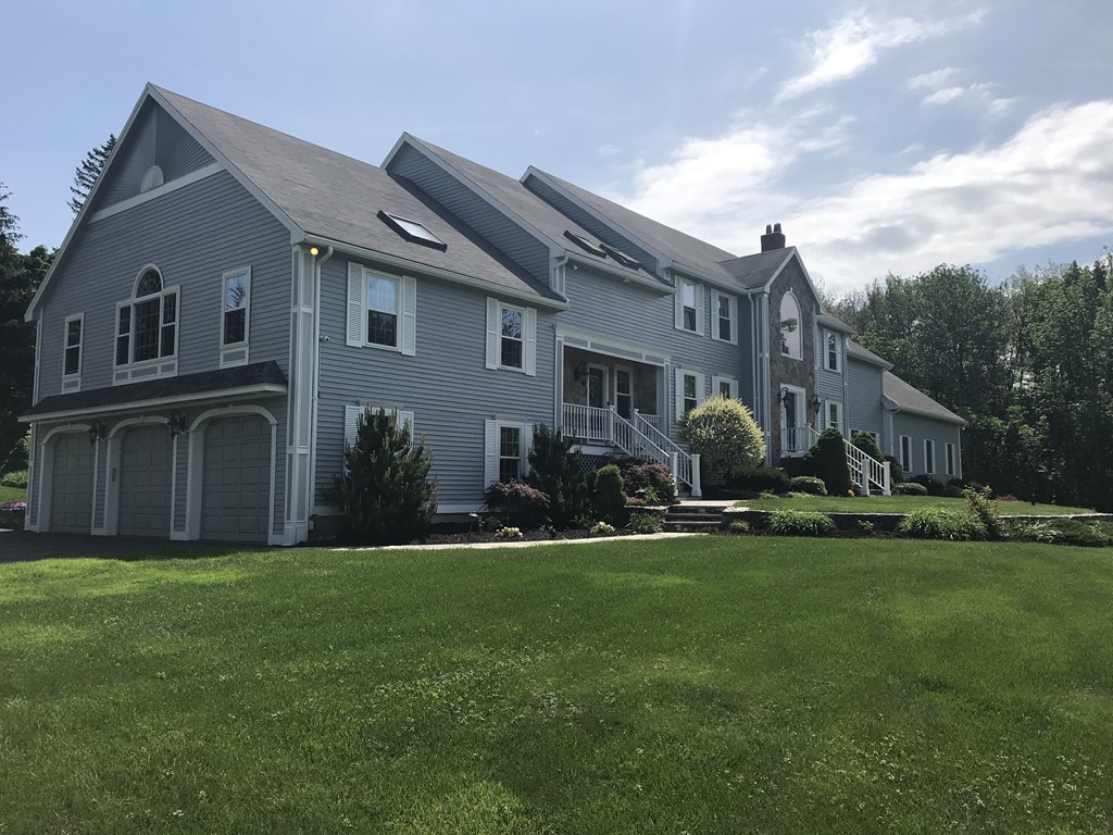 245 Haggetts Pond Road Andover, MA 01810 - Photo 1 of 30 a front view of house with yard and green space