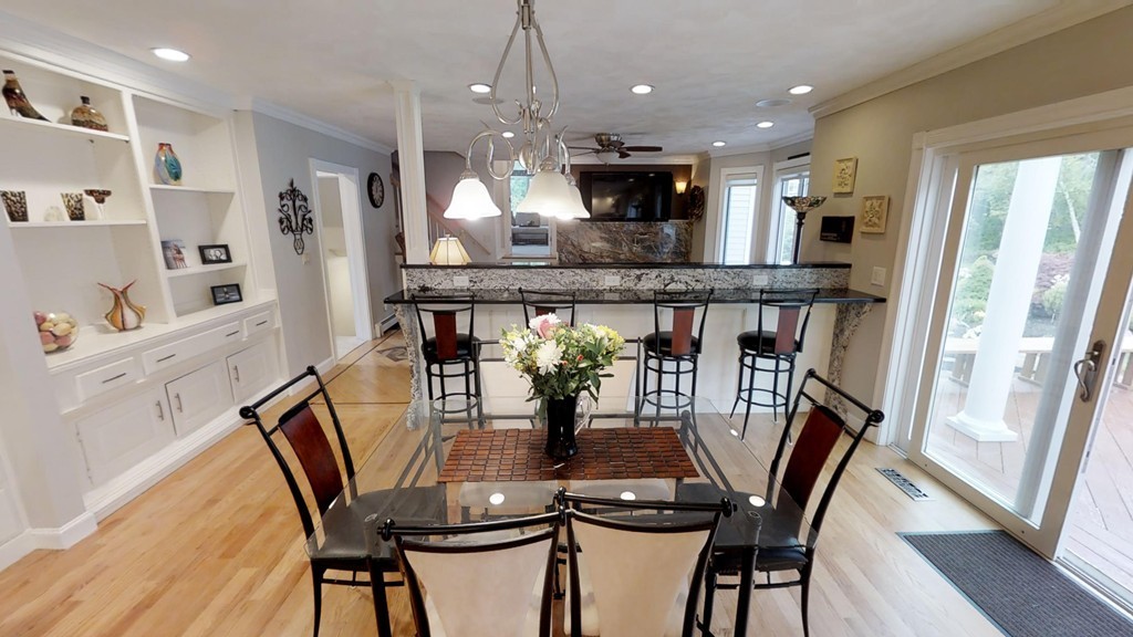 245 Haggetts Pond Road Andover, MA 01810 - Photo 4 of 30 a view of a dining room with furniture window and wooden floor