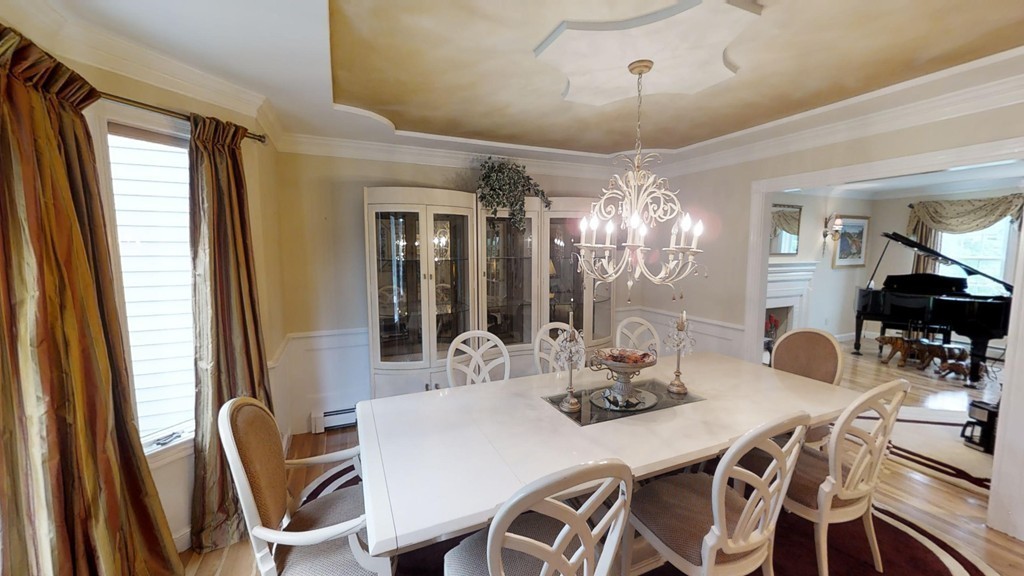 245 Haggetts Pond Road Andover, MA 01810 - Photo 6 of 30 a view of a dining room with furniture and chandelier