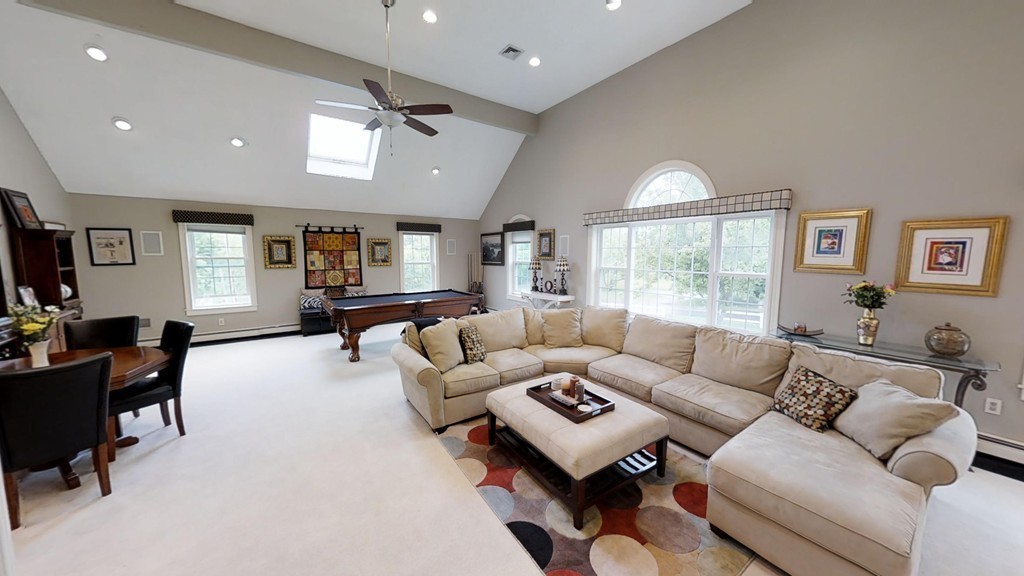 245 Haggetts Pond Road Andover, MA 01810 - Photo 7 of 30 a living room with furniture and a large window