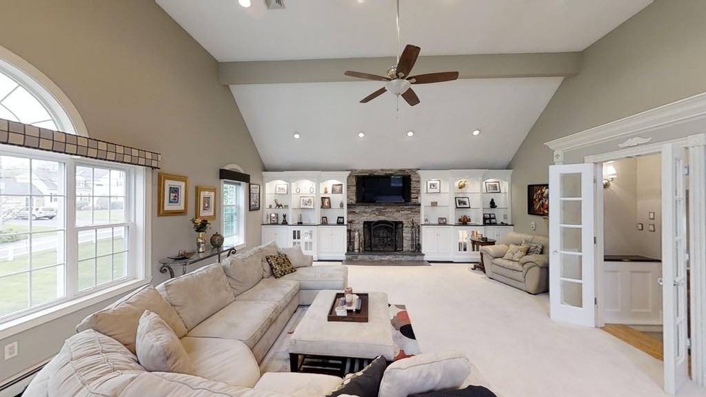 245 Haggetts Pond Road Andover, MA 01810 - Photo 9 of 30 a living room with furniture and a large window