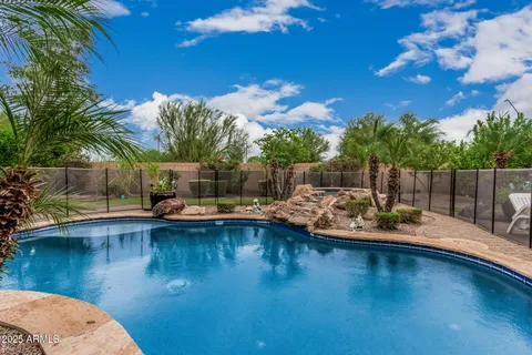 a view of a swimming pool with a patio