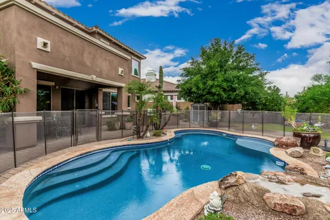 a view of a backyard with sitting area and slide