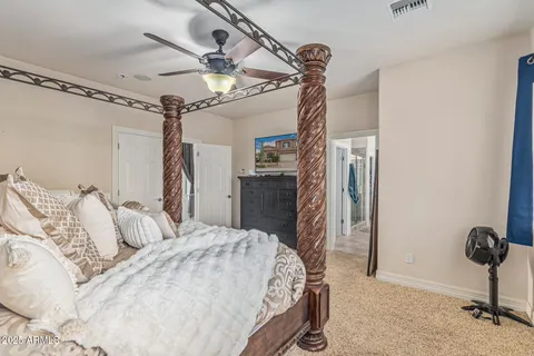 a large bathroom with a double vanity sink a mirror and a bathtub