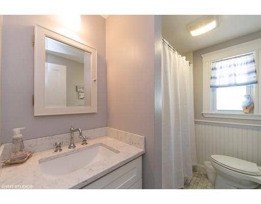 29 Homestead Road Marblehead, MA 01945 - Photo 23 of 37 a bathroom with a granite countertop sink toilet and mirror