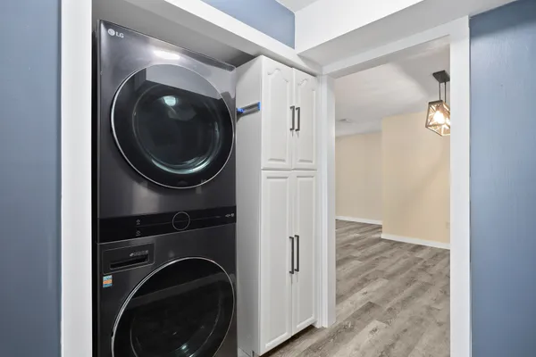 a view of a hallway with washer and dryer
