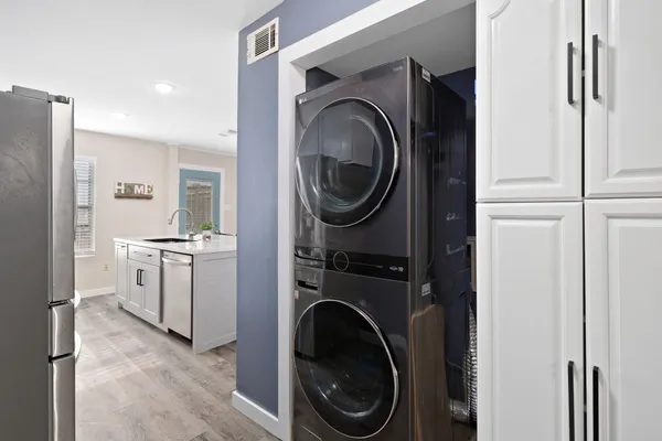 a view of a hallway with washer and dryer
