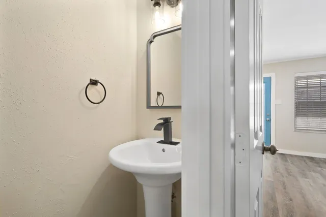 a bathroom with a sink and mirror