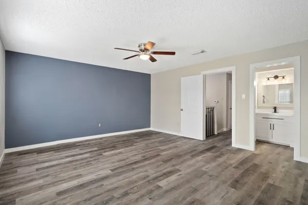 a view of an empty room with a bathroom