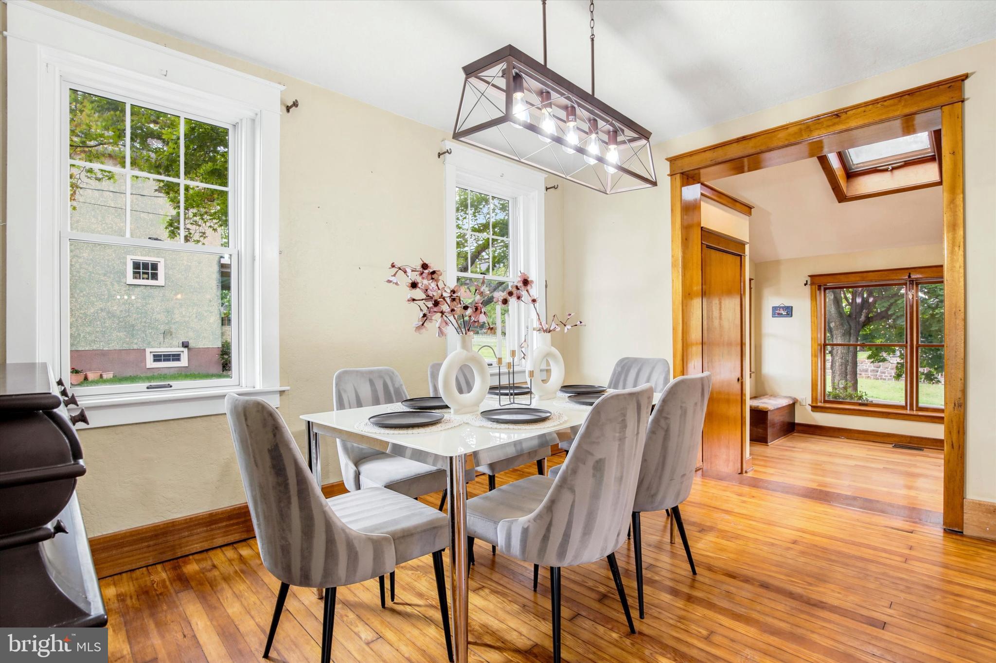 3131 Bedminster Road Ottsville, PA 18942 - Photo 10 of 23 a dining room with furniture a chandelier and wooden floor
