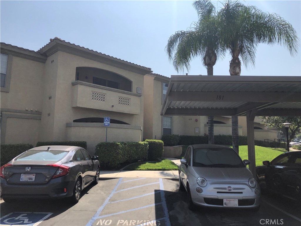 375 Central, Unit 124 Riverside, CA 92507 - Photo 18 of 31 a car parked in front of a house