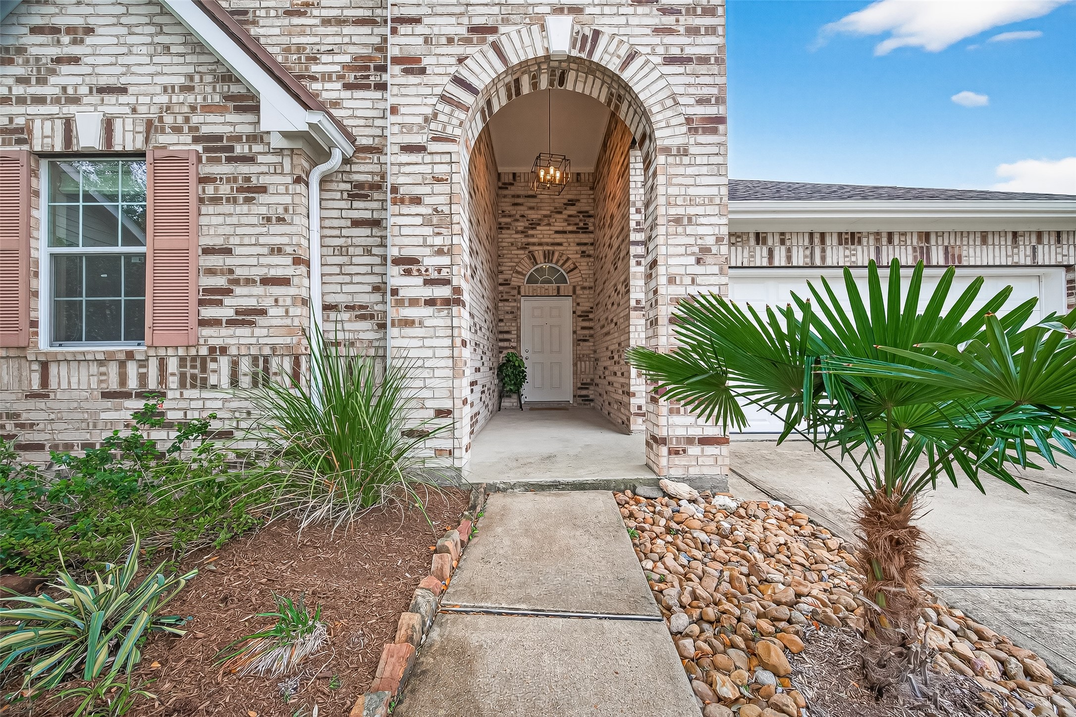 9110 Cavalier Lane Rosenberg, TX 77469 - Photo 2 of 30 a front view of a house with a garden