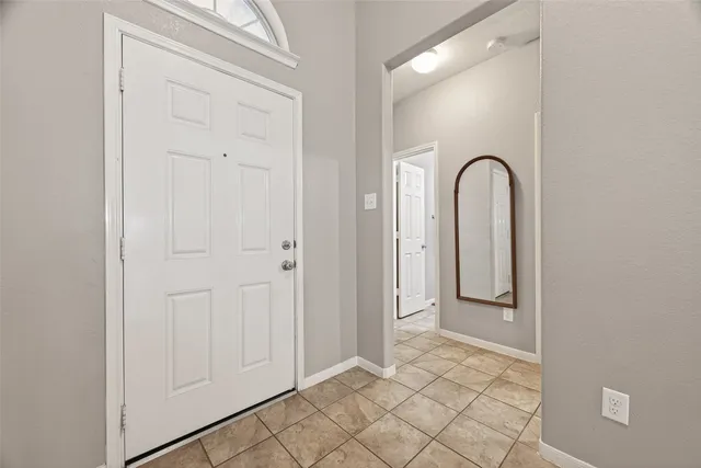 an empty room with mirror