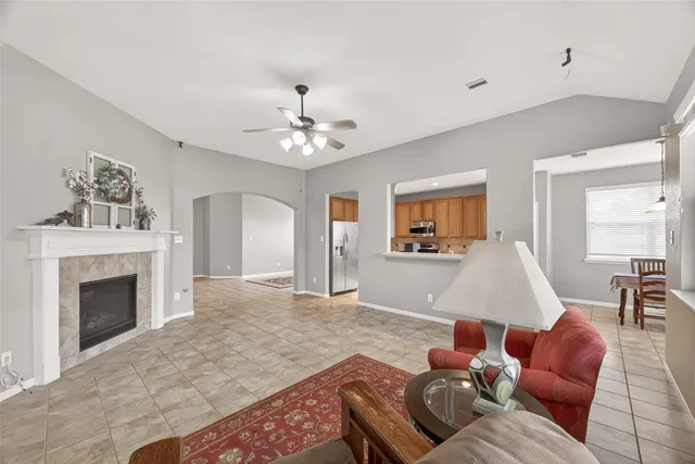 a living room with furniture and a fireplace