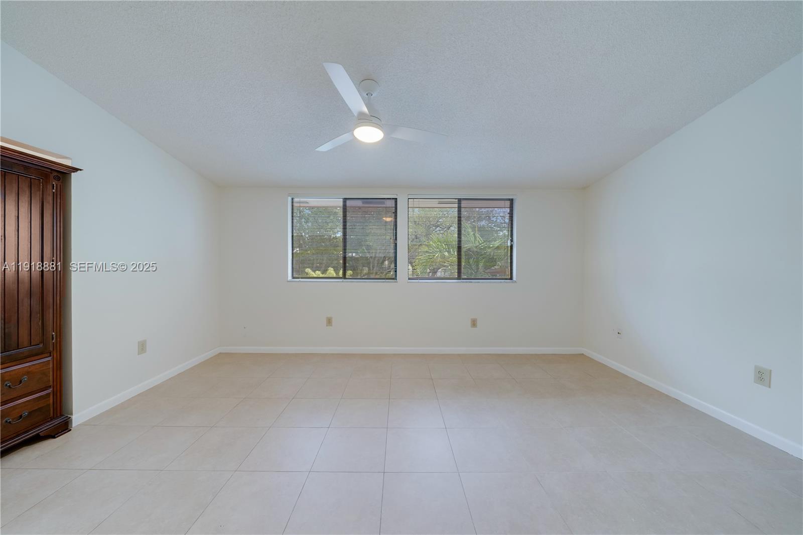 7827 Southwest 106th Circle, Unit 7827 Miami, FL 33173 - Photo 14 of 23 an empty room with windows