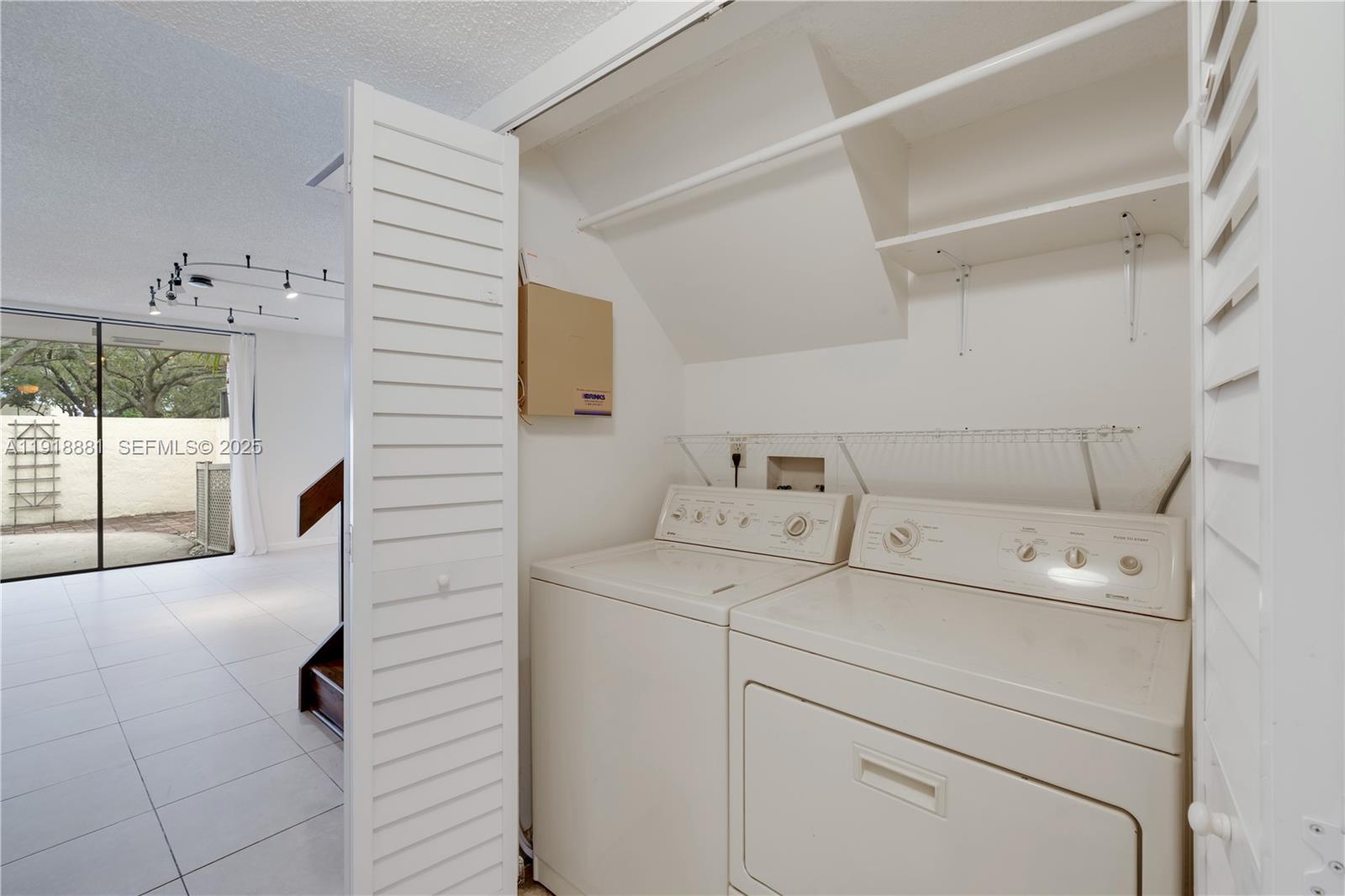 7827 Southwest 106th Circle, Unit 7827 Miami, FL 33173 - Photo 22 of 23 a utility room with dryer and washer