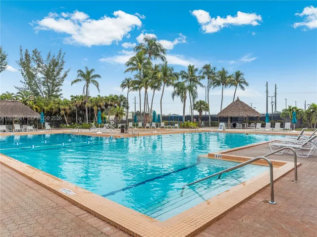 a view of swimming pool with chairs