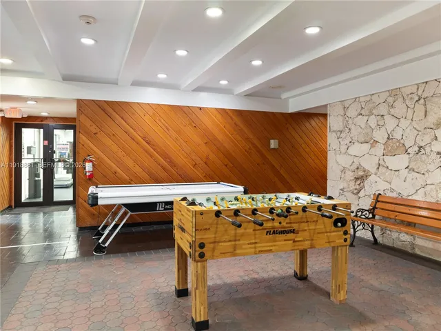 a room with table chair table and chairs