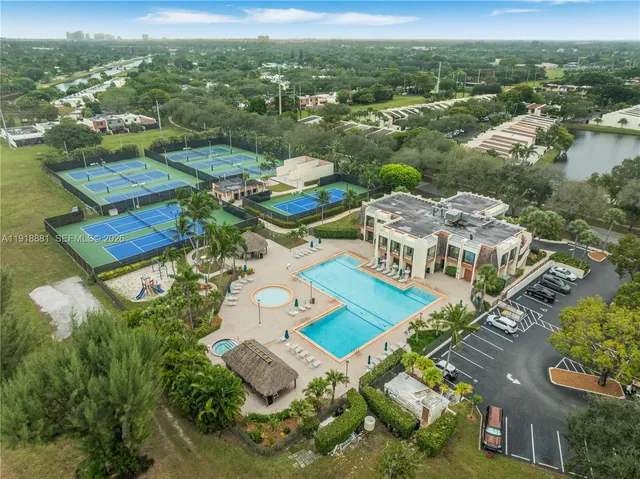 an aerial view of multiple houses with yard