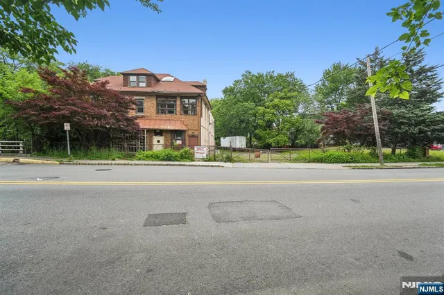 a view of a house with a street
