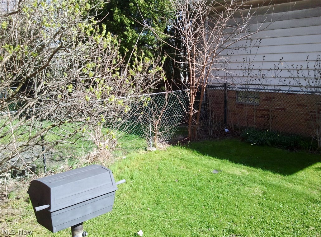 16320 Rockside Road Maple Heights, OH 44137 - Photo 3 of 11 Fenced in yard with built-in gas grill.