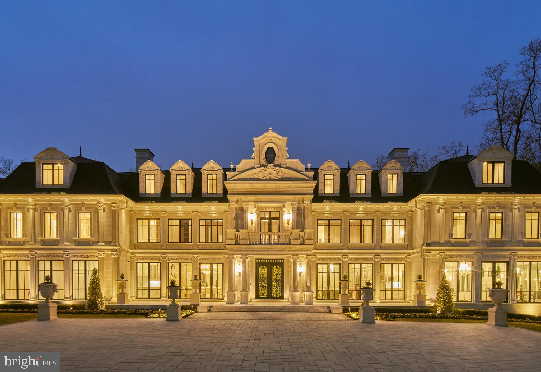 a front view of a residential apartment building with a garage