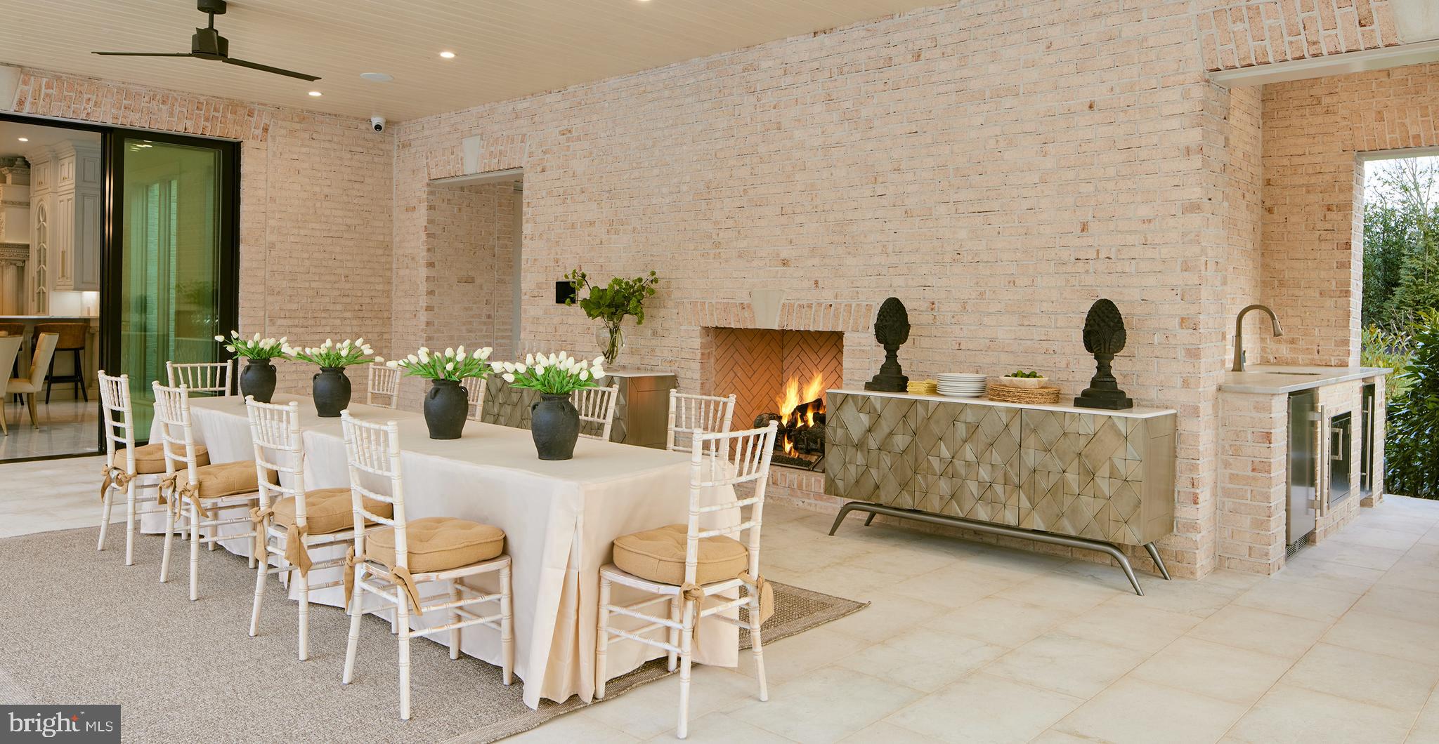 6431 Georgetown Pike McLean, VA 22101 - Photo 5 of 9 a dining room with furniture and a fireplace