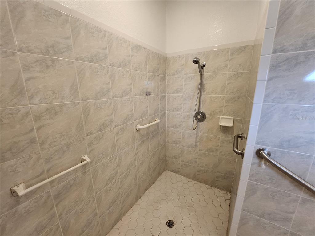 23104 Rountree Avenue Port Charlotte, FL 33980 - Photo 21 of 41 a bathroom with a bath tub