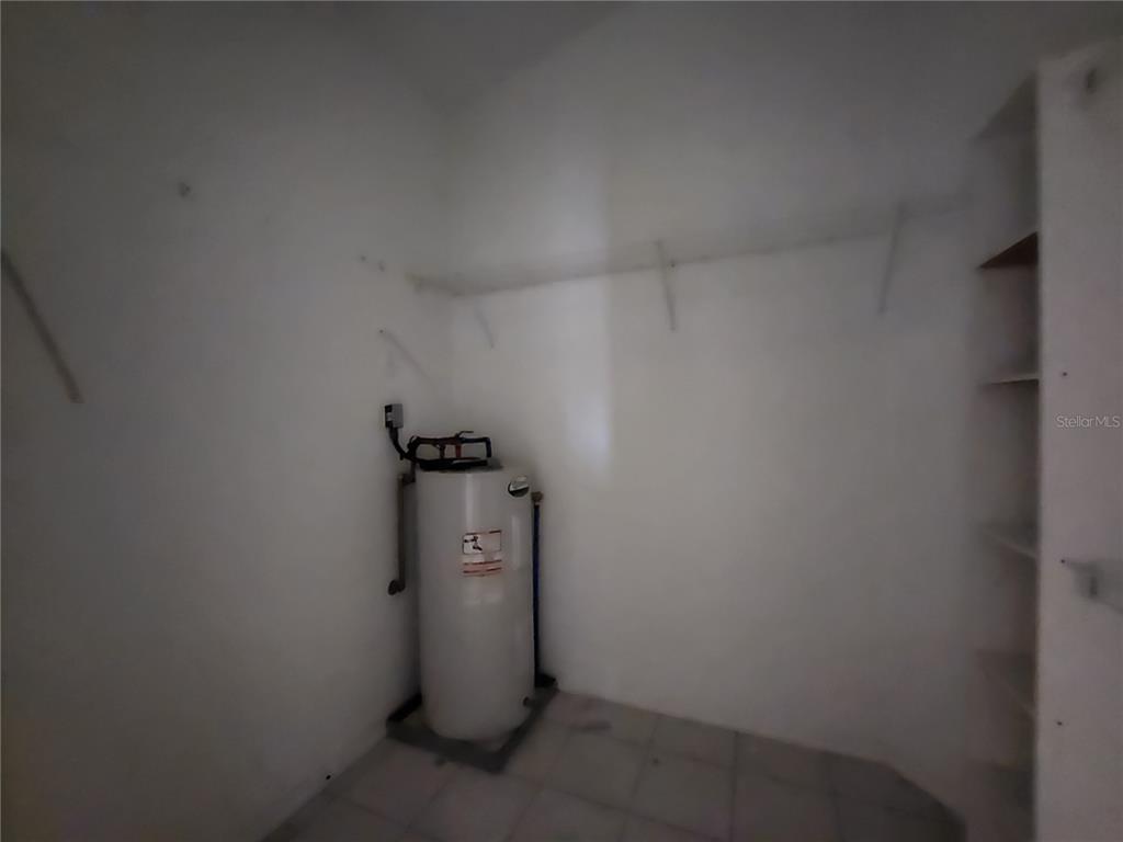 23104 Rountree Avenue Port Charlotte, FL 33980 - Photo 22 of 41 a view of a storage & utility room with a door