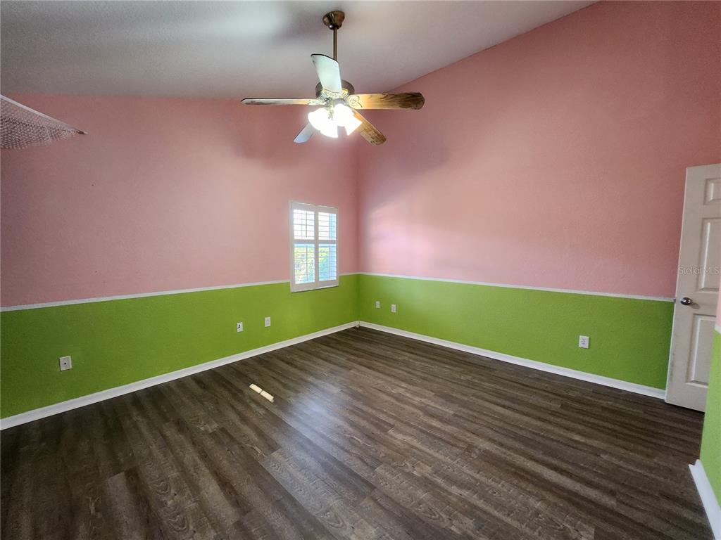 23104 Rountree Avenue Port Charlotte, FL 33980 - Photo 24 of 41 a view of room with window and wooden floor