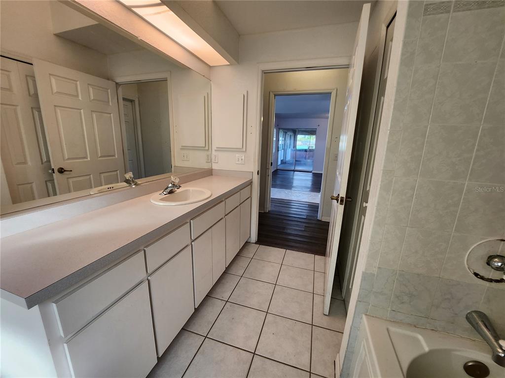 23104 Rountree Avenue Port Charlotte, FL 33980 - Photo 29 of 41 a bathroom with a sink and a mirror