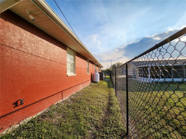 a backyard of a house with lots of green space