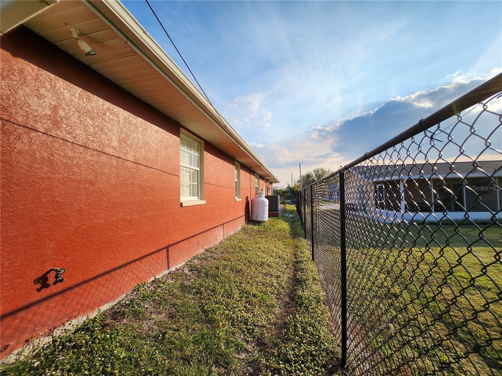 23104 Rountree Avenue Port Charlotte, FL 33980 - Photo 40 of 41 a view of a backyard