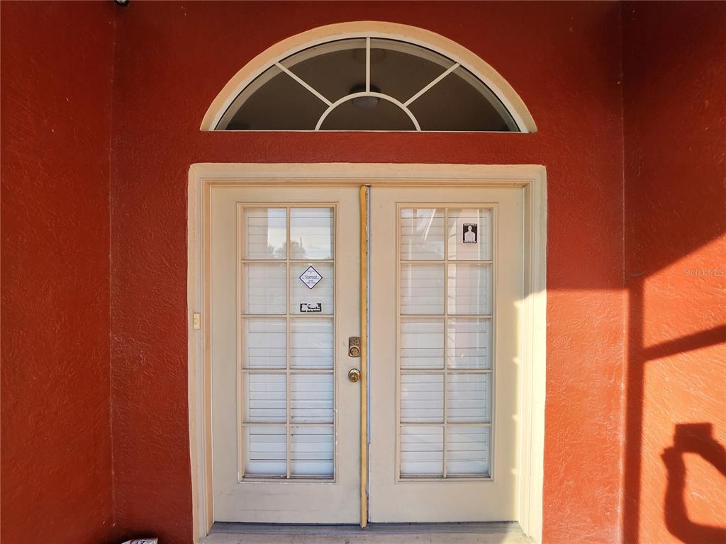 23104 Rountree Avenue Port Charlotte, FL 33980 - Photo 4 of 41 a view of wooden door