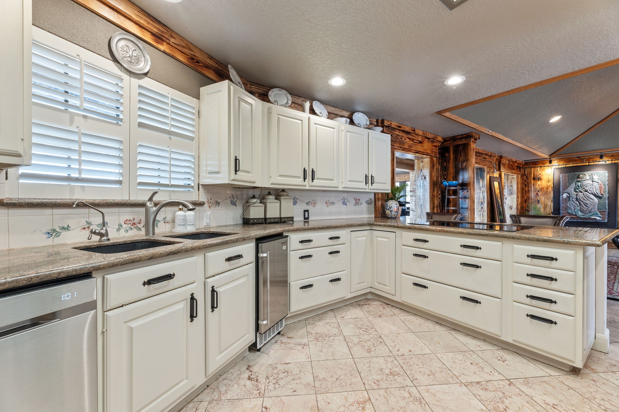 1226 County Road 45 Angleton, TX 77515 - Photo 25 of 44 a kitchen with granite countertop white cabinets white stainless steel appliances with a sink and dishwasher a oven with white cabinets