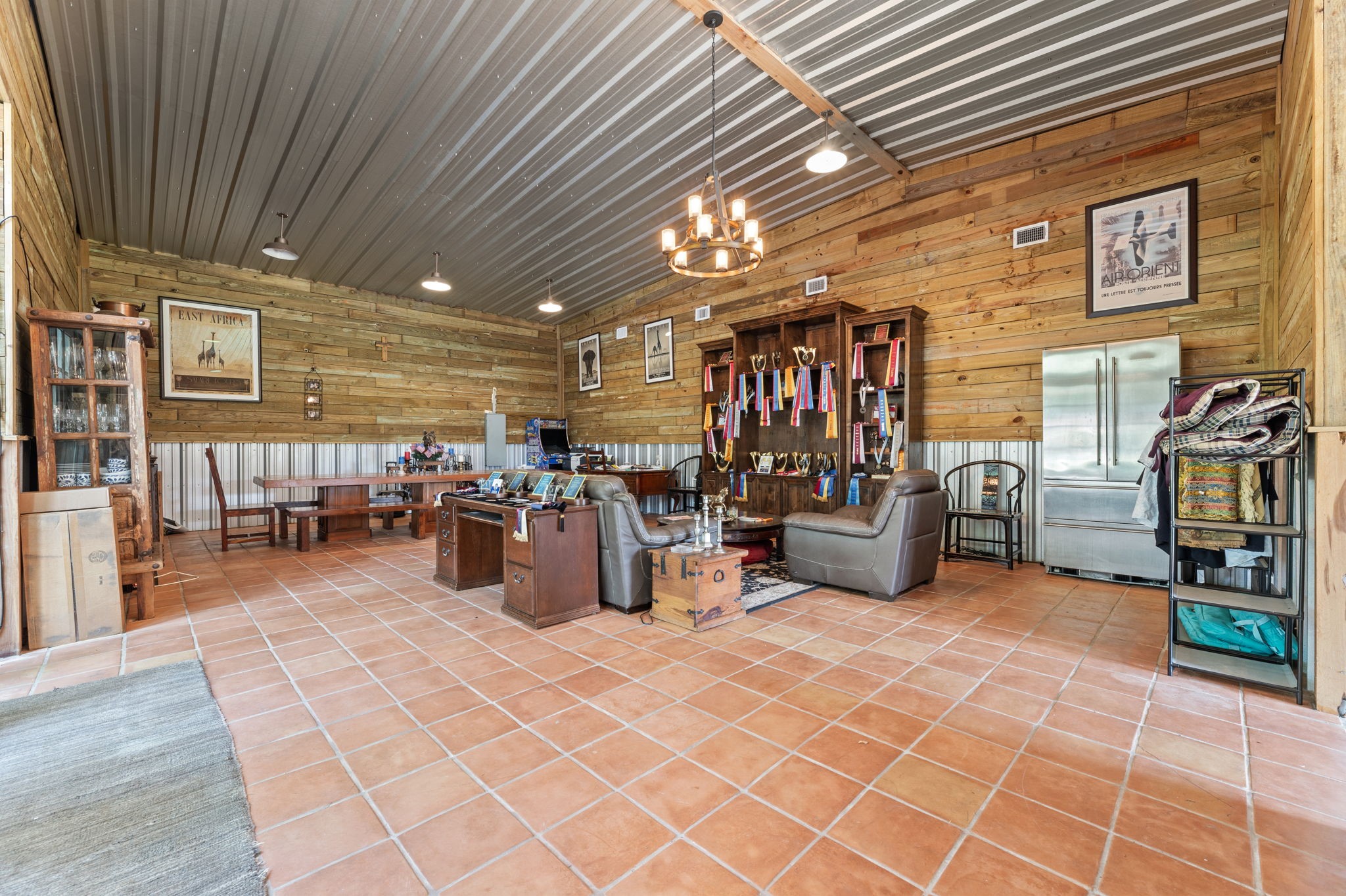 1226 County Road 45 Angleton, TX 77515 - Photo 29 of 44 a gym room with lots of furniture and clutter