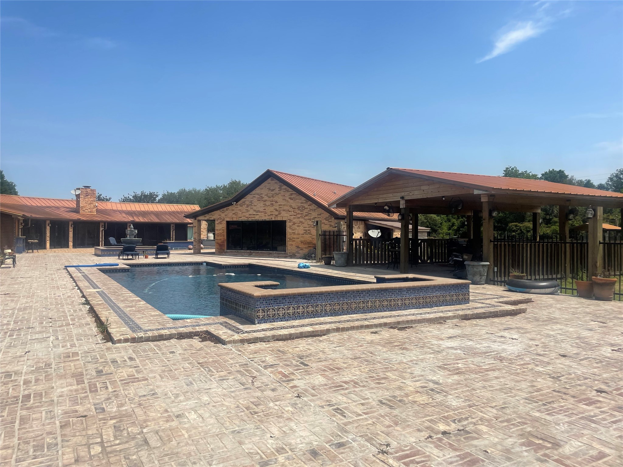 1226 County Road 45 Angleton, TX 77515 - Photo 10 of 44 a view of a house with roof deck
