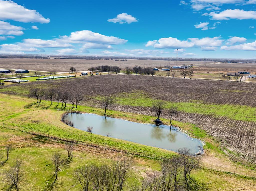 1920 Moseley Road Ennis, TX 75119 - Photo 16 of 19 a view of an swimming pool and an ocean view