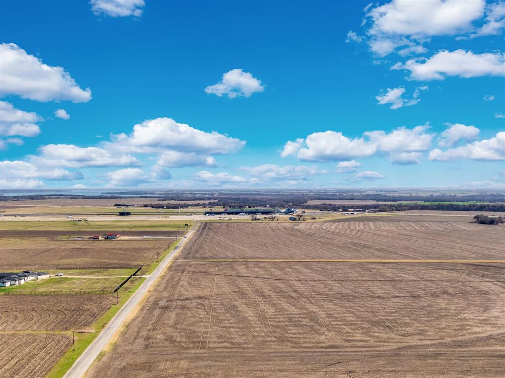 1920 Moseley Road Ennis, TX 75119 - Photo 19 of 19 a view of a swimming pool with an ocean view