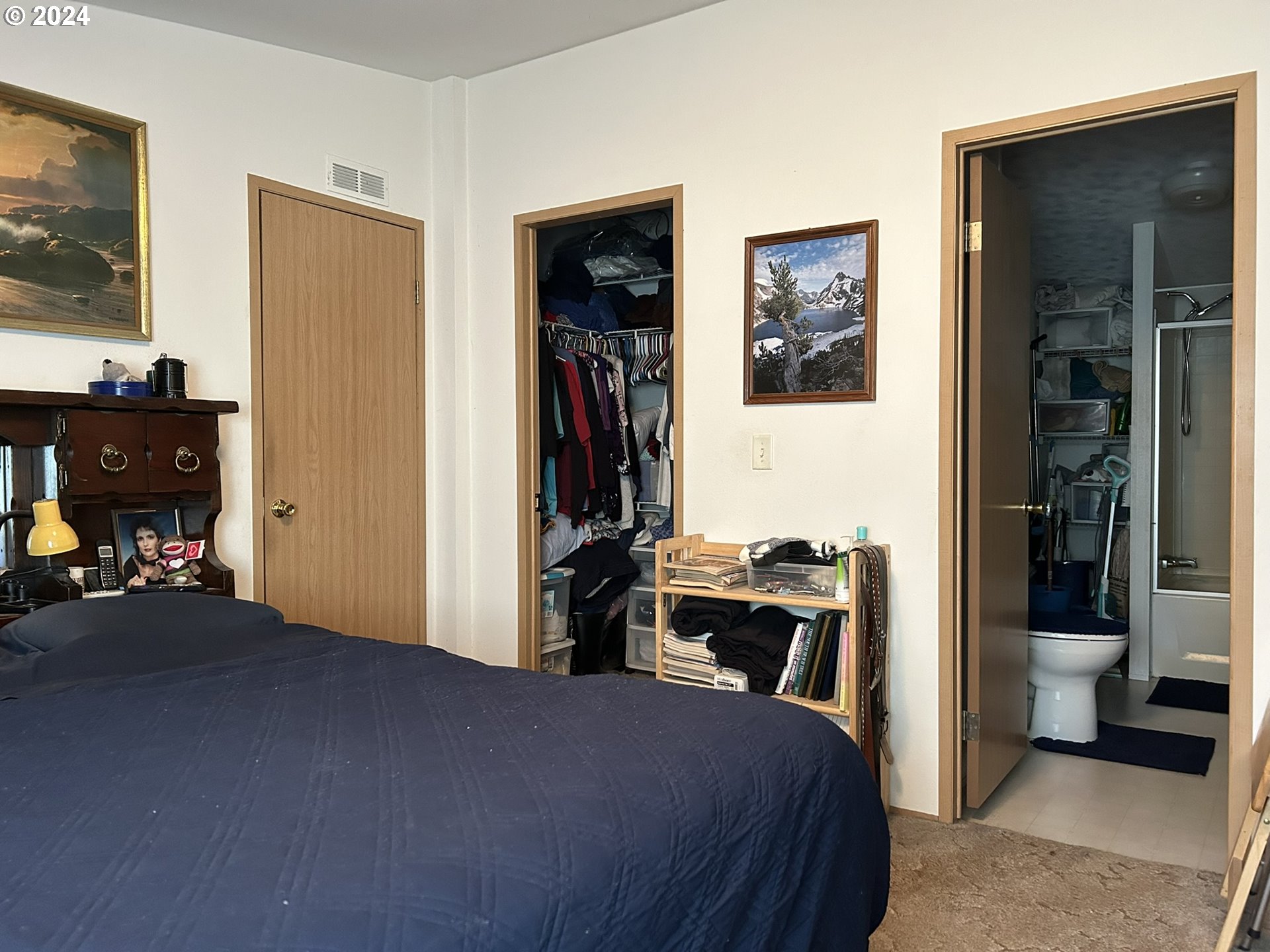 5391 Buckskin Bob Road Florence, OR 97439 - Photo 13 of 42 a bed room with a bed and a television