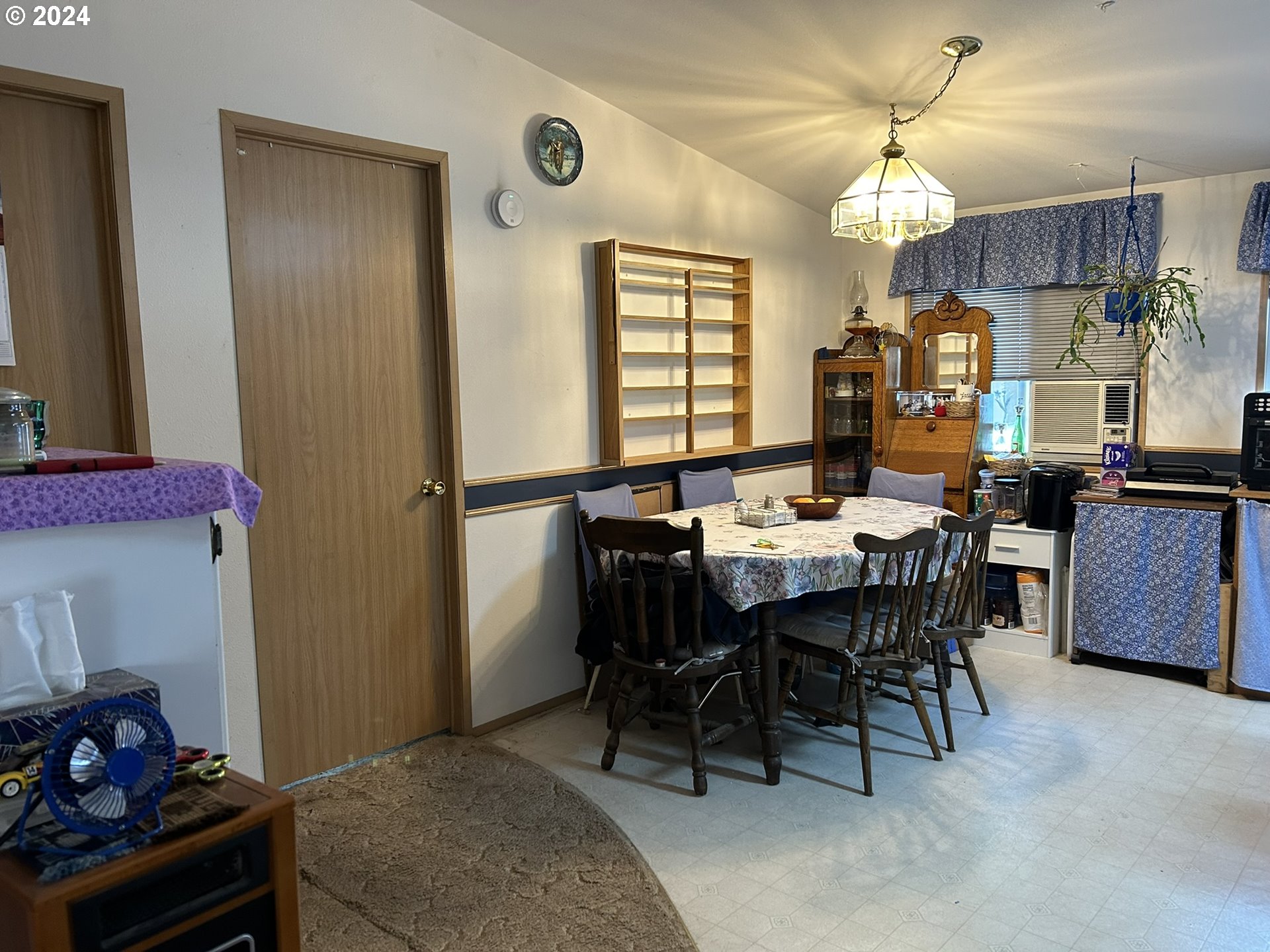 5391 Buckskin Bob Road Florence, OR 97439 - Photo 14 of 42 a view of a dining room with furniture and chandelier